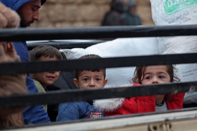 Residents of Aleppo's Sheikh Maqsoud area evacuate their neighbourhood after warnings from the Syrian army that called on civilians to get out of harms way, following the refusal of Kurdish fighter forces to leave Aleppo, on January 9, 2026. Syria's army warned on January 9 it would renew attacks against a Kurdish-majority district of Aleppo and urged residents to evacuate, state media reported, hours after a ceasefire was announced. (Photo by OMAR HAJ KADOUR / AFP)