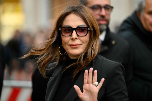 Italy's Minister of Tourism, Daniela Santanche, arrives at the Basilica of Saints Ambrose and Charles for a mass in memory of the victims of the Crans-Montana New-Year fire, in Rome on January 9, 2026. (Photo by Alberto PIZZOLI / AFP)