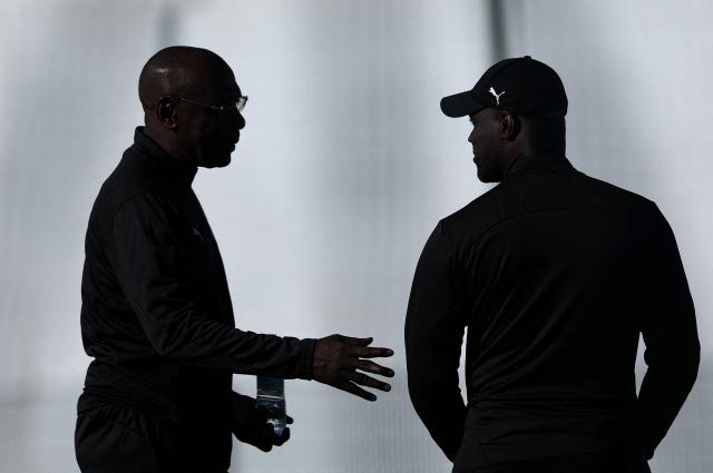 Ivory Coast's head coach Emerse Fae (R) speaks with staff members during a training session at the Agadir Stadium, Morocco, on January 9, 2026, on the eve of the Africa Cup of Nations (CAN) round of the quarter-final football match between Egypt and Ivory Coast. (Photo by FRANCK FIFE / AFP)