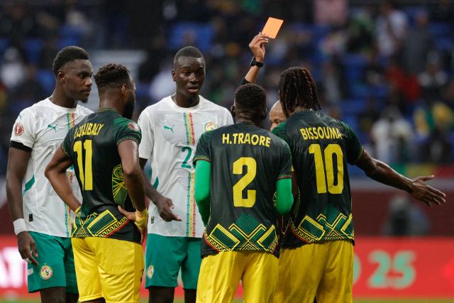 Mali's midfielder #10 Yves Bissouma receives a red card during the Africa Cup of Nations (CAN) quarter-final football match between Mali and Senegal at the Grand Stadium in Tangiers on January 9, 2026. (Photo by Abdel Majid BZIOUAT / AFP)