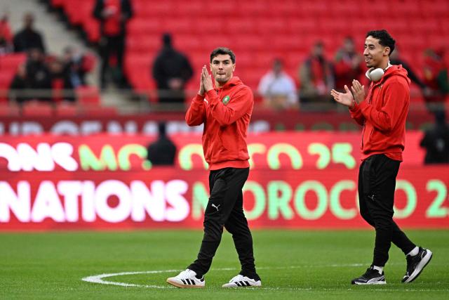 Morocco's forward #10 Brahim Diaz (L) and Morocco's defender #26 Anass Salah-Eddine arrive for the Africa Cup of Nations (CAN) quarter-final football match between Cameroon and Morocco at the Prince Moulay Abdallah stadium in Rabat on January 9, 2026. (Photo by Gabriel BOUYS / AFP)