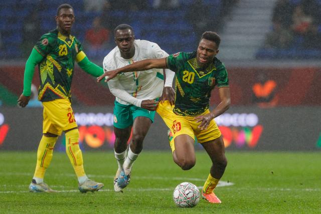 Senegal's midfielder #07 Habib Diarra fights for the ball with Mali's midfielder #20 Mamadou Sangare during the Africa Cup of Nations (CAN) quarter-final football match between Mali and Senegal at the Grand Stadium in Tangiers on January 9, 2026. (Photo by Abdel Majid BZIOUAT / AFP)