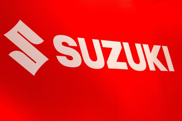 This photograph shows the logo of Japanese automobile manufacturer Suzuki during a press opening of the 102th edition of the Brussels Motor Show, at Brussels Expo in Brussels on January 9, 2026. (Photo by BENOIT DOPPAGNE / Belga / AFP) / Belgium OUT