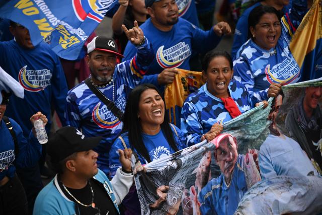 Members of Venezuela’s fishing and aquaculture sector attend a march in Caracas on January 9, 2026, to demand the release of deposed Venezuelan president Nicolas Maduro and his wife Cilia Flores, snatched and taken to New York on January 3 to face trial on drug and weapons charges. Colombia's President Gustavo Petro on January 9. urged Venezuela to jointly fight drug-traffickers operating across the two countries' border, after the United States threatened further armed action in the region. (Photo by Federico PARRA / AFP)