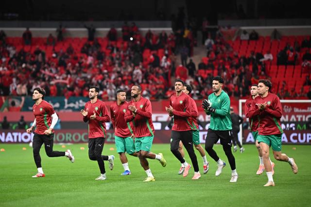 Morocco's players warm-up before the Africa Cup of Nations (CAN) quarter-final football match between Cameroon and Morocco at the Prince Moulay Abdallah stadium in Rabat on January 9, 2026. (Photo by Paul ELLIS / AFP)