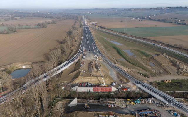 (FILES) An aerial view shows a section of the A69 autoroute under construction near Verfeil, south-western France, on February 27, 2025. The court verdict is expected on January 12, 2026 in the trial concerning the extension of the A69 motorway construction site into unauthorised areas. (Photo by Ed JONES / AFP)