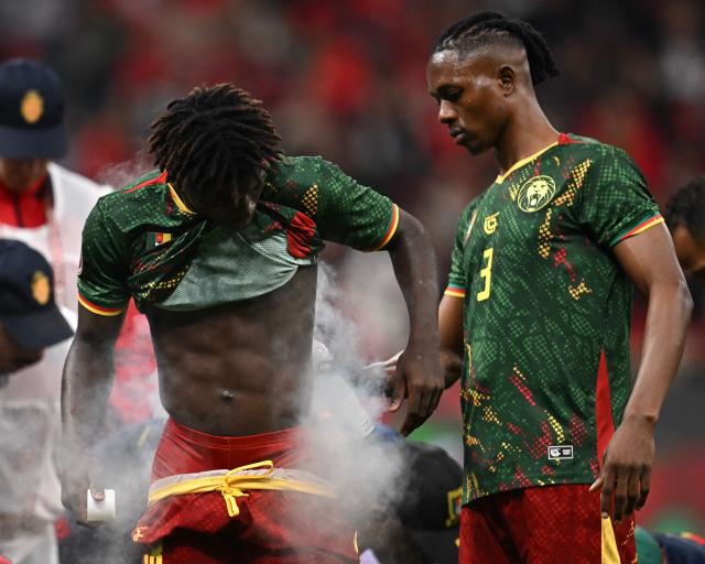 Cameroon's defender #03 Che Malone sprays Cameroon's defender #18 Mahamadou Nagida during the Africa Cup of Nations (CAN) quarter-final football match between Cameroon and Morocco at the Prince Moulay Abdallah stadium in Rabat on January 9, 2026. (Photo by Paul ELLIS / AFP)