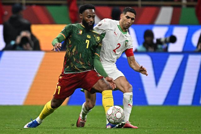 Cameroon's forward #07 Georges-Kevin N'Koudou fights for the ball with Morocco's defender #02 Achraf Hakimi during the Africa Cup of Nations (CAN) quarter-final football match between Cameroon and Morocco at the Prince Moulay Abdallah stadium in Rabat on January 9, 2026. (Photo by Gabriel BOUYS / AFP)