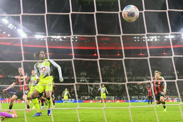 Dortmund's English midfielder #17 Carney Chukwuemeka scores the 3-3 goal during the German first division Bundesliga football match between Eintracht Frankfurt and BVB Borussia Dortmund in Frankfurt am Main, western Germany, on January 9, 2026. (Photo by Kirill KUDRYAVTSEV / AFP) / DFL REGULATIONS PROHIBIT ANY USE OF PHOTOGRAPHS AS IMAGE SEQUENCES AND/OR QUASI-VIDEO