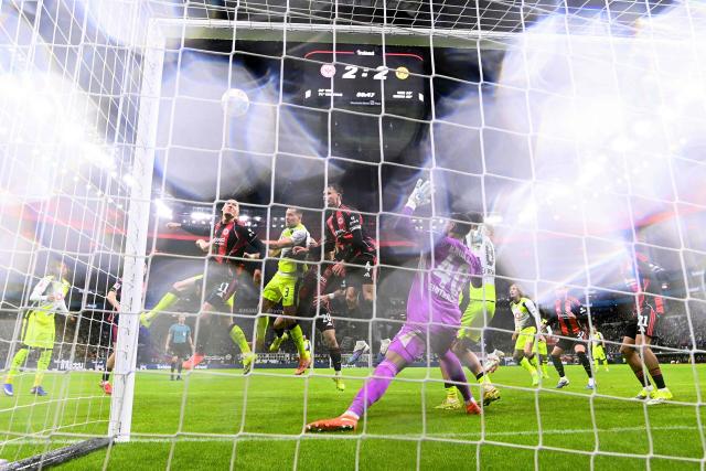 Frankfurt's German forward #11 Younes Ebnoutalib jumps to head the ball next to Dortmund's German defender #03 Waldemar Anton during the German first division Bundesliga football match between Eintracht Frankfurt and BVB Borussia Dortmund in Frankfurt am Main, western Germany, on January 9, 2026. (Photo by Kirill KUDRYAVTSEV / AFP) / DFL REGULATIONS PROHIBIT ANY USE OF PHOTOGRAPHS AS IMAGE SEQUENCES AND/OR QUASI-VIDEO