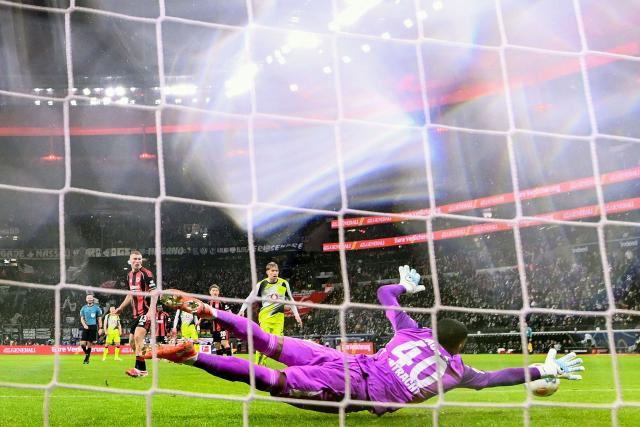 Dortmund's German midfielder #08 Felix Nmecha (not in picture) scores the 1-2 goal past Frankfurt's Brazilian goalkeeper #40 Kaua Santos during the German first division Bundesliga football match between Eintracht Frankfurt and BVB Borussia Dortmund in Frankfurt am Main, western Germany, on January 9, 2026. (Photo by Kirill KUDRYAVTSEV / AFP) / DFL REGULATIONS PROHIBIT ANY USE OF PHOTOGRAPHS AS IMAGE SEQUENCES AND/OR QUASI-VIDEO  ALTERNATIVE CROP