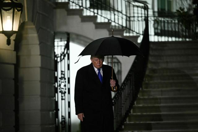 US President Donald Trump walks to speaks to reporters as he departs from the South Lawn of the White House in Washington, DC, on January 9, 2026. Trump is traveling to Mar-a-Lago for the weekend. (Photo by Brendan SMIALOWSKI / AFP)