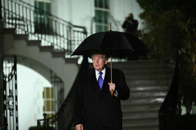 US President Donald Trump walks to speak to reporters as he departs from the South Lawn of the White House in Washington, DC, on January 9, 2026. Trump is traveling to Mar-a-Lago for the weekend. (Photo by Brendan SMIALOWSKI / AFP)