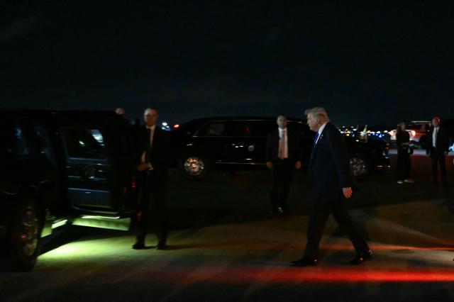 US President Donald Trump walks to his vehicle after stepping off Air Force One upon arrival at Palm Beach International Airport in West Palm Beach, Florida on January 9, 2026. President Trump is in Florida to spend the week-end at his Mar-a-Lago estate. (Photo by ANDREW CABALLERO-REYNOLDS / AFP)