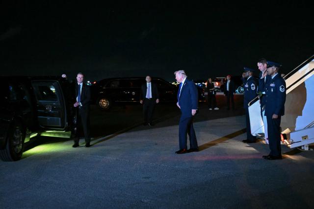 US President Donald Trump walks to his vehicle after stepping off Air Force One upon arrival at Palm Beach International Airport in West Palm Beach, Florida on January 9, 2026. President Trump is in Florida to spend the week-end at his Mar-a-Lago estate. (Photo by ANDREW CABALLERO-REYNOLDS / AFP)