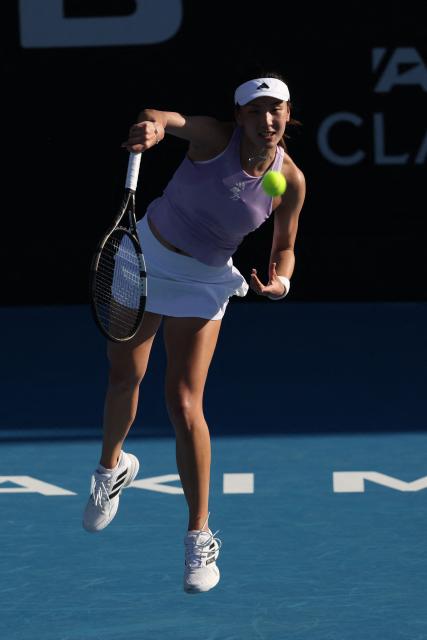 Wang Xinyu of China serves to Alexandra Eala of the Philippines during their women's singles semi-final match at the WTA Auckland Classic tennis tournament in Auckland on January 10, 2026. (Photo by Michael Bradley / AFP)