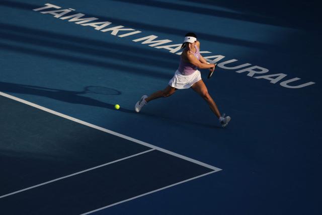 Wang Xinyu of China hits a return to Alexandra Eala of the Philippines during their women's singles semi-final match at the WTA Auckland Classic tennis tournament in Auckland on January 10, 2026. (Photo by Michael Bradley / AFP)