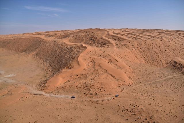 Ford Racing’s (R) Spanish driver Nani Roma and Spanish co?pilot Alex Haro and Ford Racing’s US driver Mitch Guthrie and US co?pilot Kellon Walch compete in the Stage 6 of the 48th edition of the Dakar Rally 2026, between Hail and Riyadh, Saudi Arabia, on January 9, 2026. (Photo by Giuseppe CACACE / AFP)