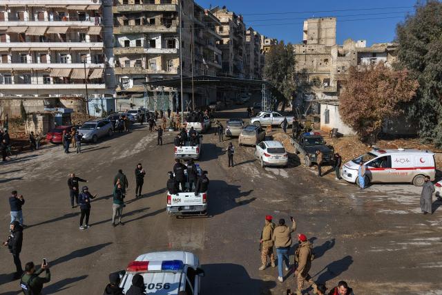 Members of Syrian government security forces patrol in their vehicles through the streets of Sheikh Maqsud neighbourhood in Aleppo on January 10, 2026, following heavy clashes with Kurdish forces. Syria's army said it had completed a "security sweep" on January 10 of a neighbourhood in Aleppo where it clashed with Kurdish forces, though shelling could still be heard following calls for fighters to surrender themselves and their weapons. (Photo by Bakr ALkasem / AFP)