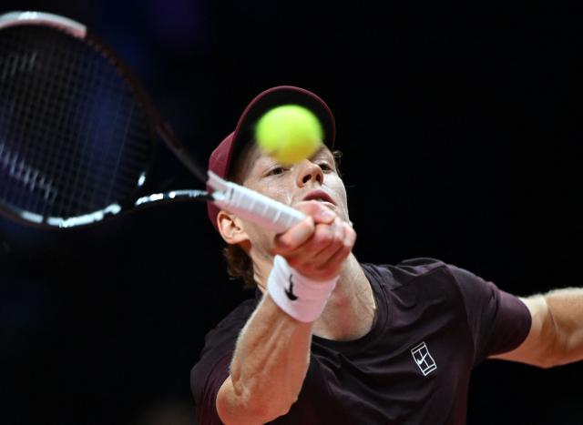 Italy's Jannik Sinner hits a return to Spain's Carlos Alcaraz during their exhibition tennis match at Inspire Arena in Incheon on January 10, 2026. (Photo by Jung Yeon-je / AFP)