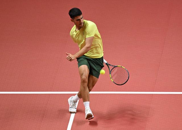 Spain's Carlos Alcaraz hits a return to Italy's Jannik Sinner during their exhibition tennis match at Inspire Arena in Incheon on January 10, 2026. (Photo by Jung Yeon-je / AFP)