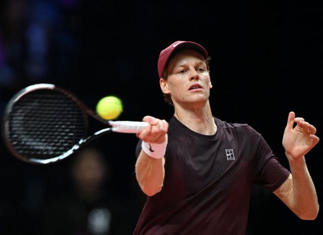 Italy's Jannik Sinner hits a return to Spain's Carlos Alcaraz during their exhibition tennis match at Inspire Arena in Incheon on January 10, 2026. (Photo by Jung Yeon-je / AFP)