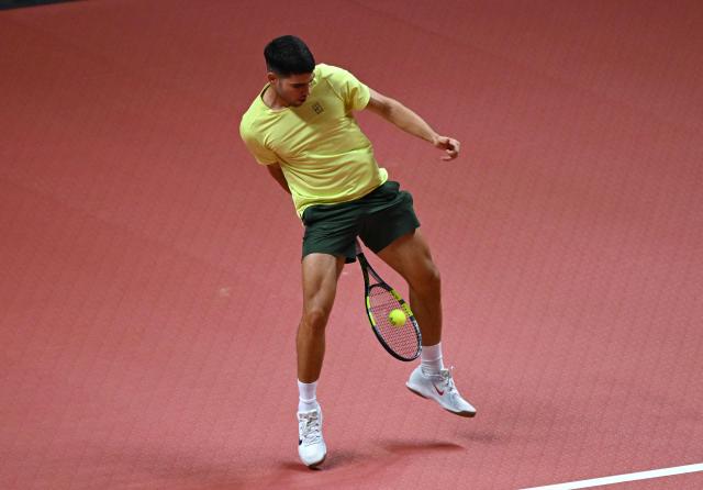 Spain's Carlos Alcaraz hits a return to Italy's Jannik Sinner during their exhibition tennis match at Inspire Arena in Incheon on January 10, 2026. (Photo by Jung Yeon-je / AFP)