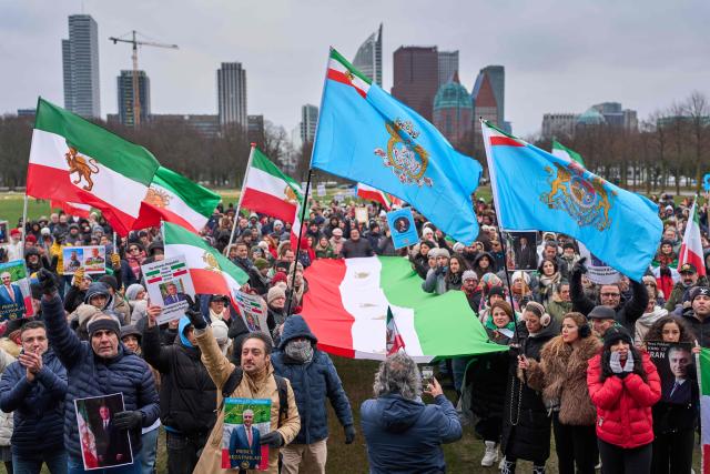 Protesters wave Iranian flags during a demonstration to support mass rallies denouncing the Islamic republic in Iran at Malieveld square in The Hague on January 10, 2026. The two weeks of protests have posed one of the biggest challenges to the theocratic authorities who have ruled Iran since the 1979 Islamic revolution, although supreme leader has expressed defiance and blamed the US. (Photo by Phil Nijhuis / ANP / AFP) / Netherlands OUT