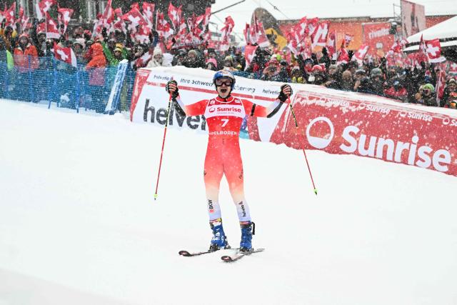 Switzerland's Marco Odermatt celebrates as he crosses the finish line to win the second run of the Men's Giant Slalom, part of the FIS Alpine Ski World Cup 2025-2026 in Adelboden, soutwestern Switzerland on January 10, 2026. (Photo by Fabrice COFFRINI / AFP)