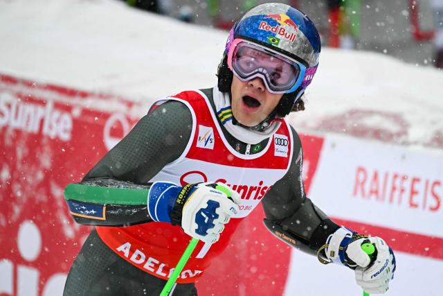 Second-placed Brazil's Lucas Pinheiro Braathen celebrates as he crosses the finish line in the second run of the Men's Giant Slalom, part of the FIS Alpine Ski World Cup 2025-2026 in Adelboden, soutwestern Switzerland on January 10, 2026. (Photo by Fabrice COFFRINI / AFP)