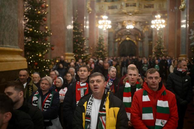Polish football fans attend a holy mass during their annual pilgrimage at the Jasna Gora Monastery in Czestochowa on January 10, 2026. Polish football fans put aside their rivalries every year and gather at Poland’s holiest Catholic shrine the Jasna Gora Monastery in Czestochowa. (Photo by Sergei GAPON / AFP)