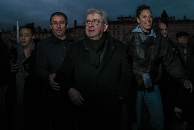 Leader of French left-wing La France Insoumise (LFI) party Jean-Luc Melenchon (C) takes part in a demonstration at Place Bellecour in Lyon, central-eastern France on January 10, 2026, to support Venezuelan people, one week after the US raids in Caracas and the detention of Venezuelan deposed President Nicolas Maduro. (Photo by OLIVIER CHASSIGNOLE / AFP)