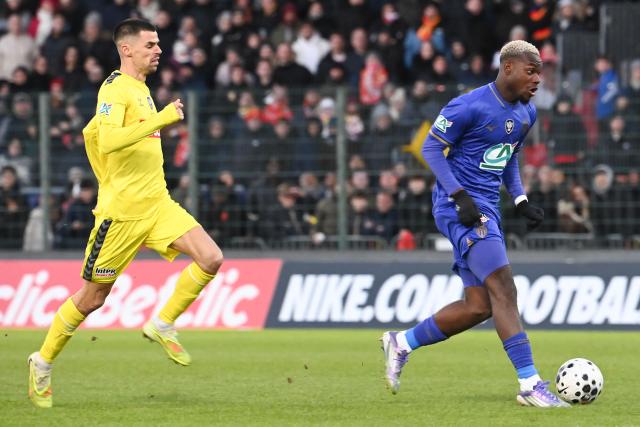 Monaco's French forward #19 George Ilenikhena scores his team's third goal during the French Cup round of 32 football match between US Orleans and AS Monaco at the Stade de la Source in Orleans, central France on January 10, 2026. (Photo by JEAN-FRANCOIS MONIER / AFP)