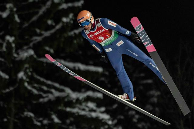 Polands Dawid Kubacki soars through the air during the Men's Large Hill HS140 Super Team competition of the FIS Ski Jumping World Cup in Zakopane, Poland on January 10, 2026. Austria won the event ahead of Slovenia and Poland. (Photo by Wojtek RADWANSKI / AFP)