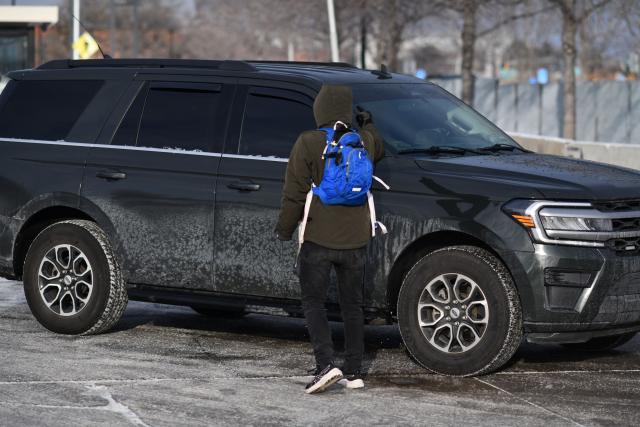 A anti-ICE protester shout at ICE agents as they exit the Bishop Henry Whipple Federal Building parking lot in during demonstrations sparked by the fatal shooting of a Renee Good by an ICE officer, Minnesota, on January 10, 2026. A US Immigration and Customs Enforcement (ICE) agent shot and killed an American woman on the streets of Minneapolis January 7, leading to huge protests and outrage from local leaders who rejected White House claims she was a domestic terrorist. The woman, identified in local media as 37-year-old Renee Nicole Good, was hit at point blank range as she apparently tried to drive away from agents who were crowding around her car, which they said was blocking their way. (Photo by Octavio JONES / AFP)