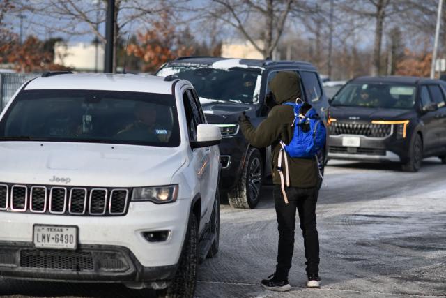A anti-ICE protester shout at ICE agents as they exit the Bishop Henry Whipple Federal Building parking lot in during demonstrations sparked by the fatal shooting of a Renee Good by an ICE officer, Minnesota, on January 10, 2026. A US Immigration and Customs Enforcement (ICE) agent shot and killed an American woman on the streets of Minneapolis January 7, leading to huge protests and outrage from local leaders who rejected White House claims she was a domestic terrorist. The woman, identified in local media as 37-year-old Renee Nicole Good, was hit at point blank range as she apparently tried to drive away from agents who were crowding around her car, which they said was blocking their way. (Photo by Octavio JONES / AFP)