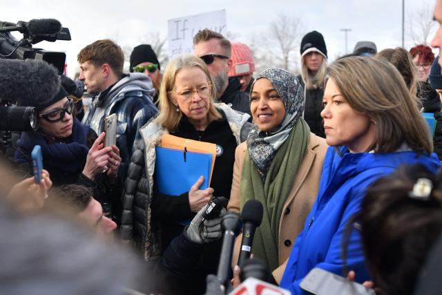 (L-R) Representative Kelly Morrison, a Democrat from Minnesota, Representative Ilhan Omar, a Democrat from Minnesota, and Representative Angie Craig, a Democrat from Minnesota, speak with reporters after visiting with immigrations officials at the Bishop Henry Whipple Federal Building after in Minneapolis, Minnesota, on January 10, 2026. A US Immigration and Customs Enforcement (ICE) agent shot and killed an American woman on the streets of Minneapolis January 7, leading to huge protests and outrage from local leaders who rejected White House claims she was a domestic terrorist. The woman, identified in local media as 37-year-old Renee Nicole Good, was hit at point blank range as she apparently tried to drive away from agents who were crowding around her car, which they said was blocking their way. (Photo by Octavio JONES / AFP)