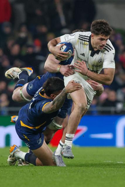 La Rochelle's Georgian wing Davit Niniashvili is tackled during the European Champions Cup Pool 3 rugby union match between Leinster and Stade Rochelais at Aviva Stadium in Dublin, Ireland on January 10, 2026. (Photo by Paul Faith / AFP)