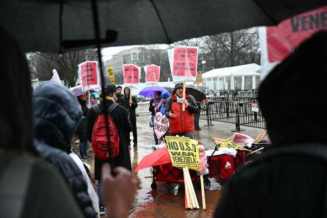 People protest against the recent US operation in Venezuela that resulted in the capture of the Venezuelan President, in Lafayette Square near the White House in Washington, DC, on January 10, 2026. (Photo by Mandel NGAN / AFP)