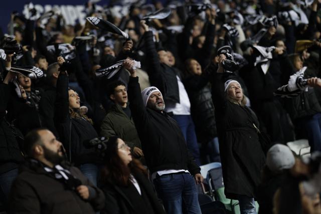 Vitoria Guimaraes SC's supporters cheer prior the Portuguese Taca da Liga (League Cup) final football match between Vitoria SC and SC Braga at the Dr. Magalhaes Pessoa stadium in Leiria, on January 10, 2026. (Photo by FILIPE AMORIM / AFP)