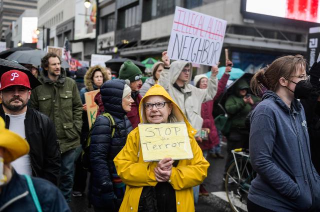 Protesters gather outside of the ICE Field office in Philadelphia, Pennsylvania during a protest against ICE and the killing of Renee Good on Saturday, January 10, 2025. A US Immigration and Customs Enforcement (ICE) agent shot and killed an American woman on the streets of Minneapolis January 7, leading to huge protests and outrage from local leaders who rejected White House claims she was a domestic terrorist. The woman, identified in local media as 37-year-old Renee Nicole Good, was hit at point blank range as she apparently tried to drive away from agents who were crowding around her car, which they said was blocking their way. (Photo by Matthew HATCHER / AFP)