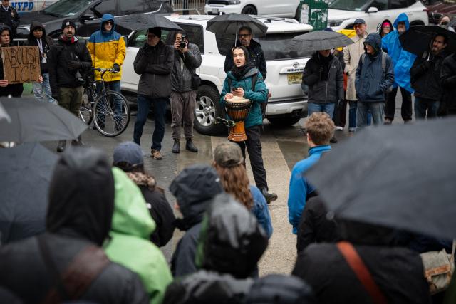 People rally against Immigration and Customs Enforcement (ICE) for the “ICE Out of New York for Good” protest outside of 26 Federal Plaza in New York City, US, January 10, 2026. A US Immigration and Customs Enforcement (ICE) agent shot and killed an American woman on the streets of Minneapolis January 7, leading to huge protests and outrage from local leaders who rejected White House claims she was a domestic terrorist. The woman, identified in local media as 37-year-old Renee Nicole Good, was hit at point blank range as she apparently tried to drive away from agents who were crowding around her car, which they said was blocking their way. (Photo by Angelina Katsanis / AFP)
