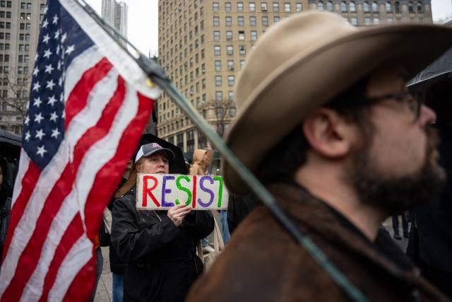 People rally against Immigration and Customs Enforcement (ICE) for the “ICE Out of New York for Good” protest outside of 26 Federal Plaza in New York City, US, January 10, 2026. A US Immigration and Customs Enforcement (ICE) agent shot and killed an American woman on the streets of Minneapolis January 7, leading to huge protests and outrage from local leaders who rejected White House claims she was a domestic terrorist. The woman, identified in local media as 37-year-old Renee Nicole Good, was hit at point blank range as she apparently tried to drive away from agents who were crowding around her car, which they said was blocking their way. (Photo by Angelina Katsanis / AFP)
