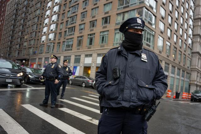 Members of the NYPD monitor the “ICE Out of New York for Good” protest outside of 26 Federal Plaza in New York City, US, January 10, 2026. A US Immigration and Customs Enforcement (ICE) agent shot and killed an American woman on the streets of Minneapolis January 7, leading to huge protests and outrage from local leaders who rejected White House claims she was a domestic terrorist. The woman, identified in local media as 37-year-old Renee Nicole Good, was hit at point blank range as she apparently tried to drive away from agents who were crowding around her car, which they said was blocking their way. (Photo by Angelina Katsanis / AFP)