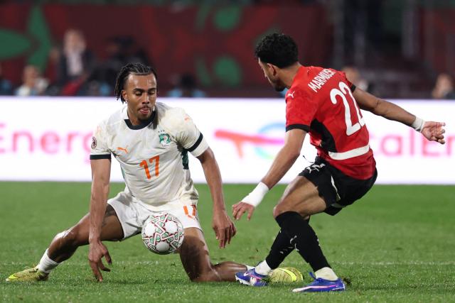 Ivory Coast's defender #17 Guela Doue and Egypt's forward #22 Omar Marmoush vie during the Africa Cup of Nations (CAN) quarter-final football match between Egypt and Ivory Coast at the Grand stadium in Agadir on January 10, 2026. (Photo by FRANCK FIFE / AFP)