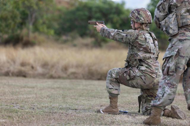 A US Army Reserve soldier fires a pistol during a live-fire training exercise at Camp Santiago in Salinas, Puerto Rico, on January 10, 2026. (Photo by Alejandro GRANADILLO / AFP)