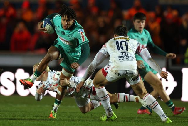 Pau's French full-back Théo Attissogbe makes a break during the European Rugby Champions Cup pool 4 rugby union match between Scarlets and Section Paloise , Pau at Parc y Scarlets in Llanelli, south-west Wales on January 10, 2026. (Photo by Adrian Dennis / AFP)