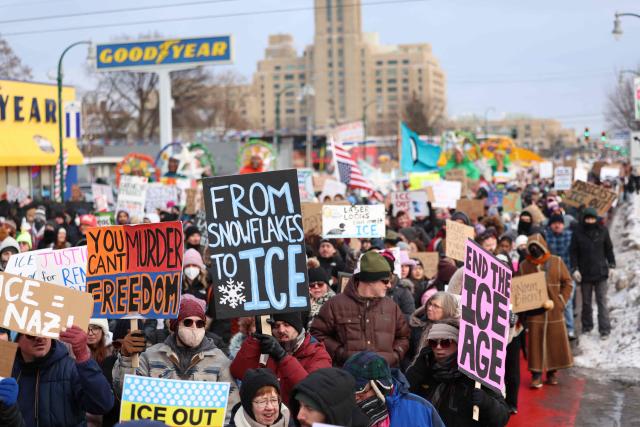 People walk through the streets to protest against ICE after the fatal shooting of Renee Nicole Good in Minneapolis, Minnesota on January 10, 2026. A US Immigration and Customs Enforcement (ICE) agent shot and killed 37-year-old Renee Nicole Good on the streets of Minneapolis on January 7, leading to huge protests and outrage from local leaders who rejected White House claims she was a domestic terrorist. (Photo by CHARLY TRIBALLEAU / AFP)