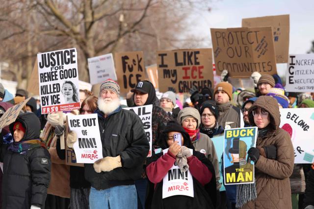People walk through the streets to protest against ICE after the fatal shooting of Renee Nicole Good in Minneapolis, Minnesota on January 10, 2026. A US Immigration and Customs Enforcement (ICE) agent shot and killed 37-year-old Renee Nicole Good on the streets of Minneapolis on January 7, leading to huge protests and outrage from local leaders who rejected White House claims she was a domestic terrorist. (Photo by CHARLY TRIBALLEAU / AFP)