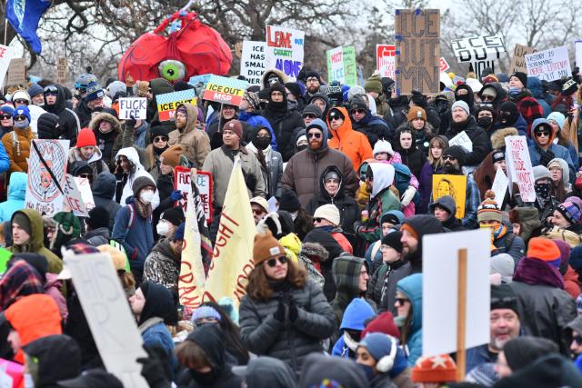 Protesters hold signs as they march from Powderhorn Park in Minneapolis against Immigration and Customs Enforcement (ICE) and the fatal shooting of Renee Good by an ICE agent, calling on federal authorities to leave the city and demand accountability, in Minneapolis, Minnesota, on January 10, 2026. A US Immigration and Customs Enforcement (ICE) agent shot and killed 37-year-old Renee Nicole Good on the streets of Minneapolis on January 7, leading to huge protests and outrage from local leaders who rejected White House claims she was a domestic terrorist. (Photo by Octavio JONES / AFP)